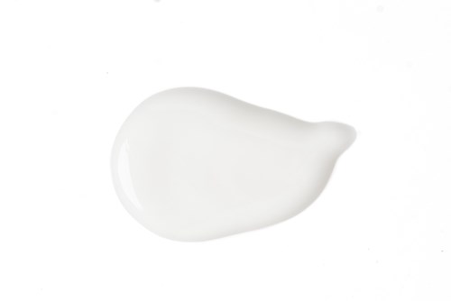 A white, creamy dollop with a rounded shape, on a plain white background.