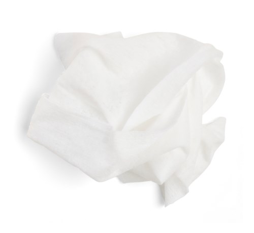 A crumpled white tissue paper on a plain white background.