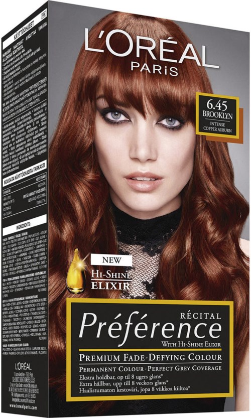 L'Oréal-hiustenväri-rasia, jossa naisella on pitkät, aaltoilevat punaiset hiukset ja rohkea meikki.