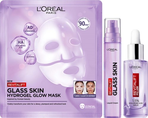 Een huidverzorgingsset met een paarse gezichtsmasker, vloeibare crème en serum voor stralende, gladde, gehydrateerde huid.