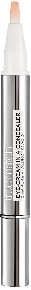 A slim silver and white tube of eye concealer with a peach-colored tip for makeup application.