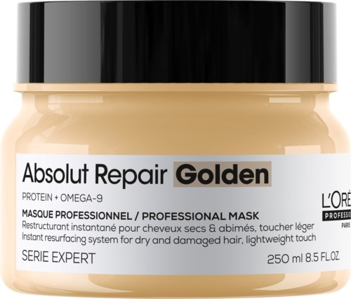 En burk hårmask märkt "Absolut Repair Golden" för torrt, skadat hår, med svart lock och detaljerad produktinformation.