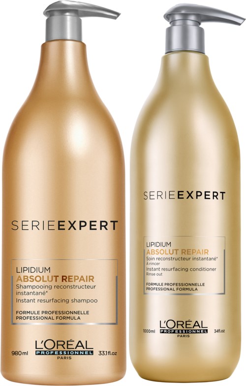 Två gyllene schampoflaskor märkta 'Lipidium Absolute Repair' och 'Serie Expert' från L'Oréal. Båda har pump.