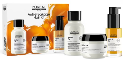 L'Oréal Anti-Breakage Hårplejesæt med flasker og glas, orange splat på emballagen, sorte og hvide låg.