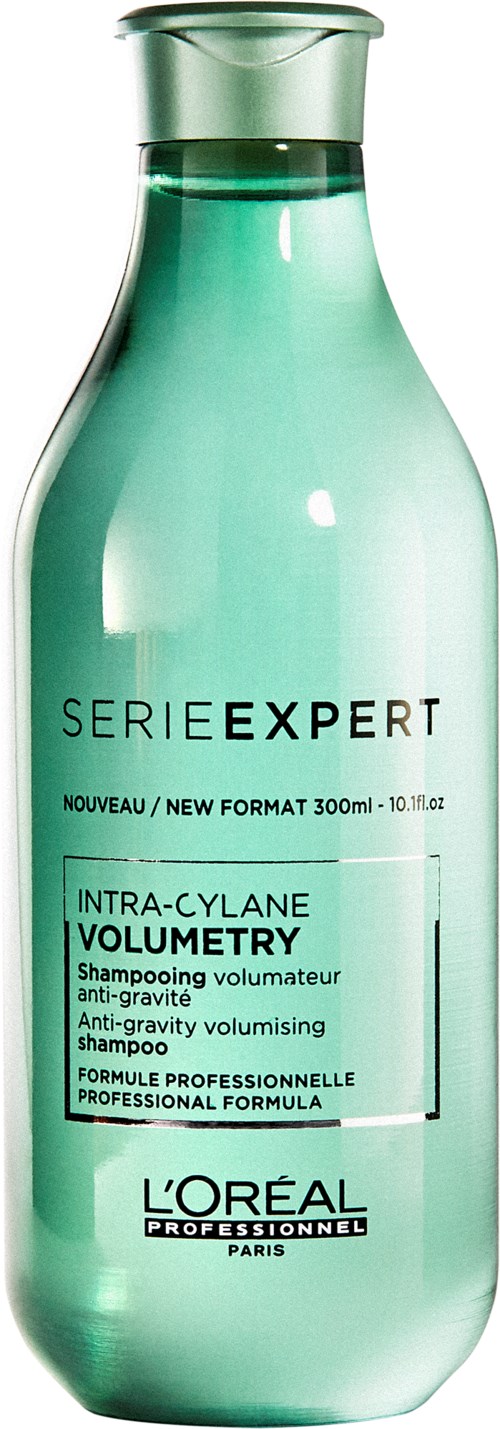 Grön schampoflaska med text som säger att den är för volym och anti-tyngd, tillverkad av L'Oréal.