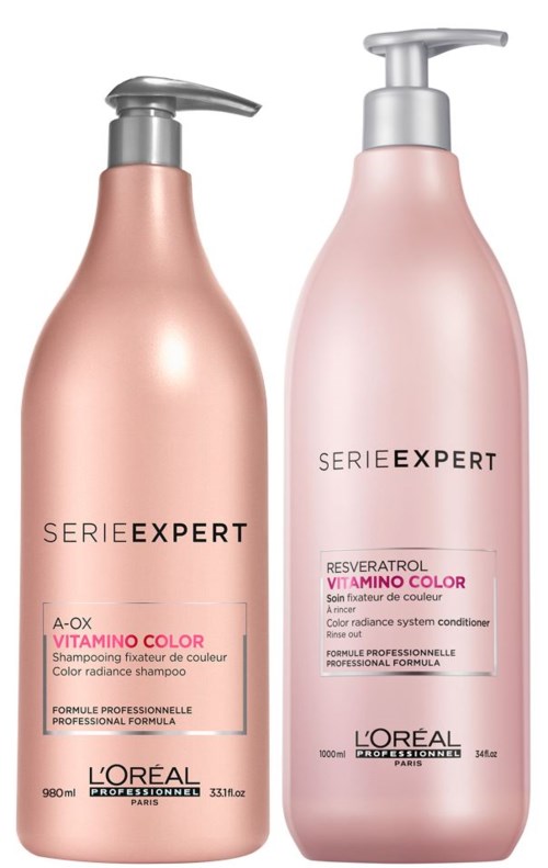Two pink bottles of L'Oréal shampoo and conditioner with silver pumps, labeled for color radiance and professional formula.