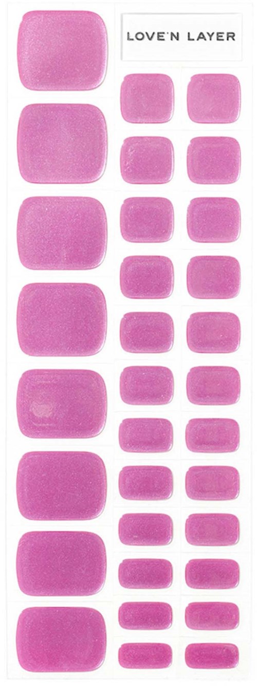 Ett klistermärkesark med rosa fyrkantiga och rektangulära klistermärken, märkt 'LOVE'N LAYER'.