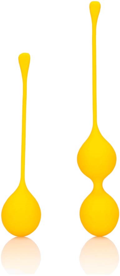 Two yellow glass tools with long, thin handles and round bulbs at the ends, different sizes.