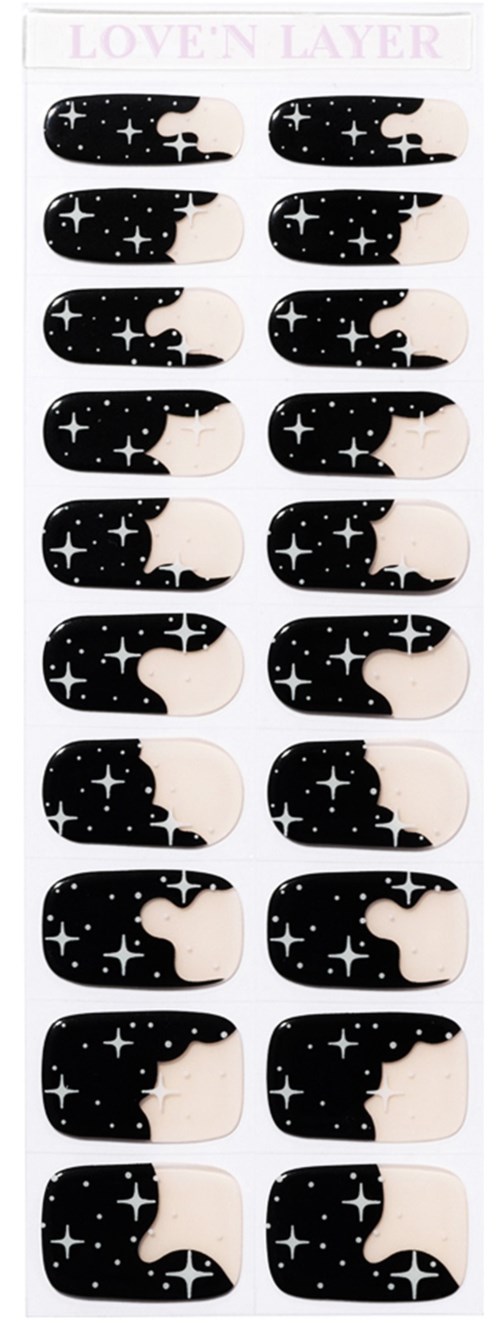 Nail stickers with a galaxy theme, featuring black and white stars and moon shapes arranged in rows.