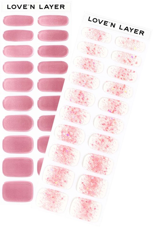 Två ark med nagelklistermärken. En har enfärgade rosa naglar; den andra har rosa naglar med glitter.