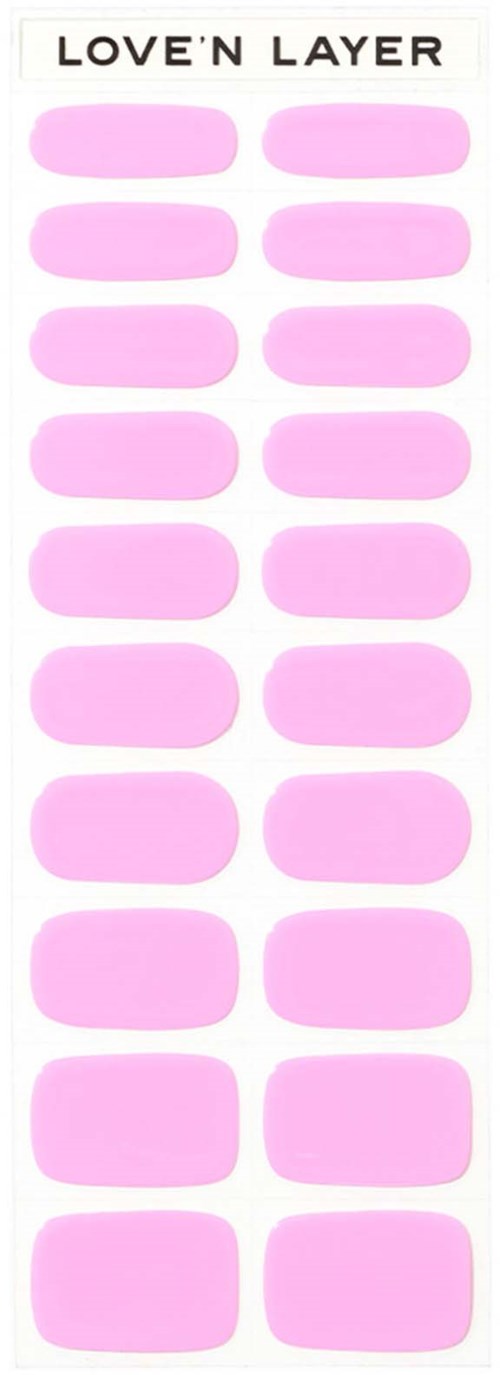A label with the text 'LOVE 'N LAYER' at the top and many pink oval stickers arranged in two columns.
