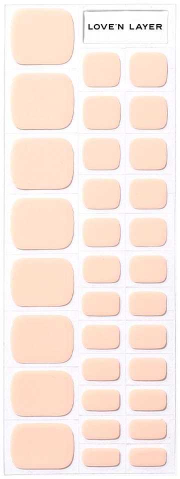 Et ark med ulike beige klistremerker merket 'LOVE'N LAYER', fra små til store.