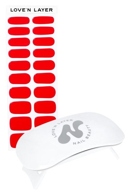 A nail beauty product called 'Love'n Layer' with red oval-shaped stickers and a white tool with the brand name.