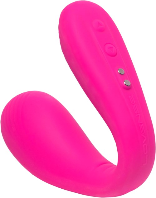 En pink buet enhed med knapper, sandsynligvis en massager eller vibrator.