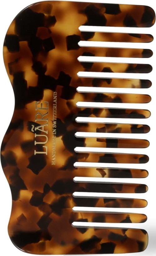 Tortoise shell hair comb with 20 teeth and the brand name 'LURE'.