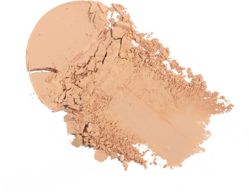 Krossat persikfärgat puder spridd ut, med några stora bitar och fin damm. Ser ut som en krossad makeup- eller kosmetikprodukt.