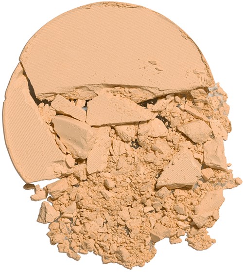 Desidert beige pulver, ser ut som sminke eller ansiktspudder, med større biter og fin støv.