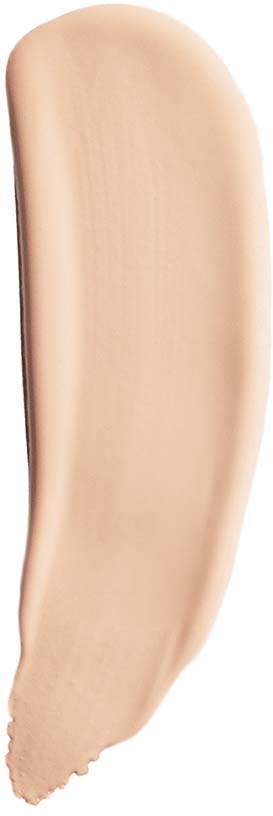 Ett försök av beige foundation eller concealer, med en slät textur och rundad form.