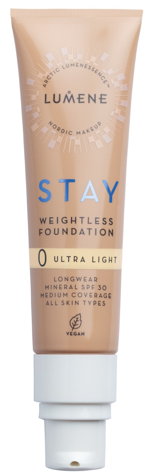 A beige tube of Lumene Stay foundation with a white cap, labeled as lightweight, vegan, and suitable for all skin types.