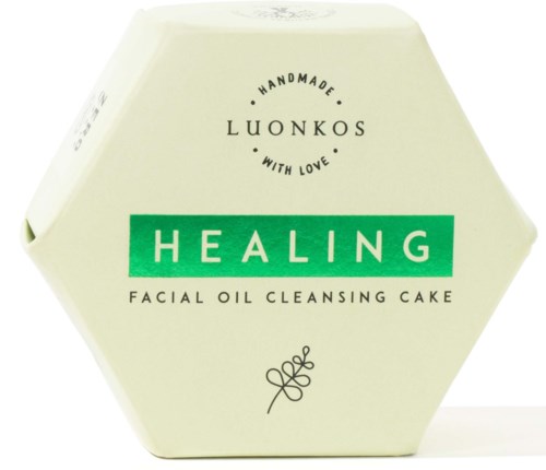 Hexagon-shaped packaging for a facial oil cleansing cake with green and black text, handmade branding, and a leaf design.
