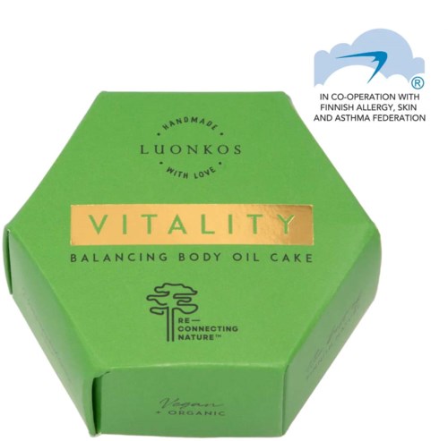 Groene zeshoekige doos voor Vitality evenwichtige lichaamsoliecake met Fins allergie-, huid- en astma-voetafdrukkenlogo.