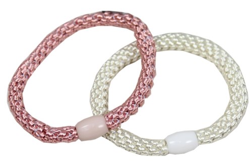 Two fabric hair ties, one pink and one cream, with white beads. They are shaped like circles and used for hair.