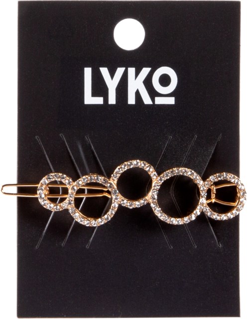 En dekorativ hårklämma med cirkulära ringar med rhinestones på ett svart kort med texten 'LYKO'.