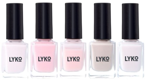 Five bottles of nail polish in white, pink, beige, gray, and clear with black caps and LYKO labels.