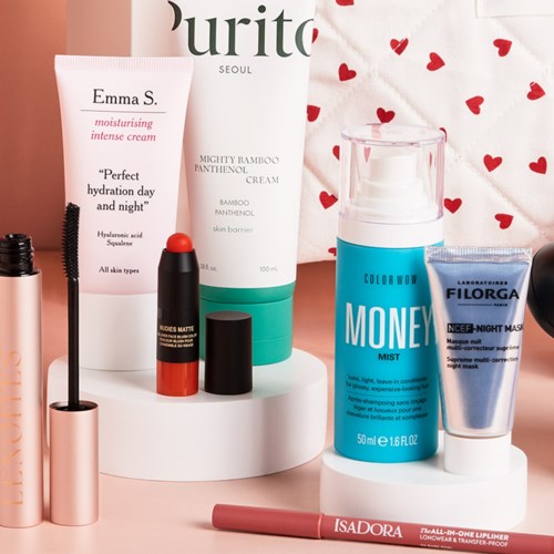 A collection of skincare and makeup products on a white stand with a pink and white background.