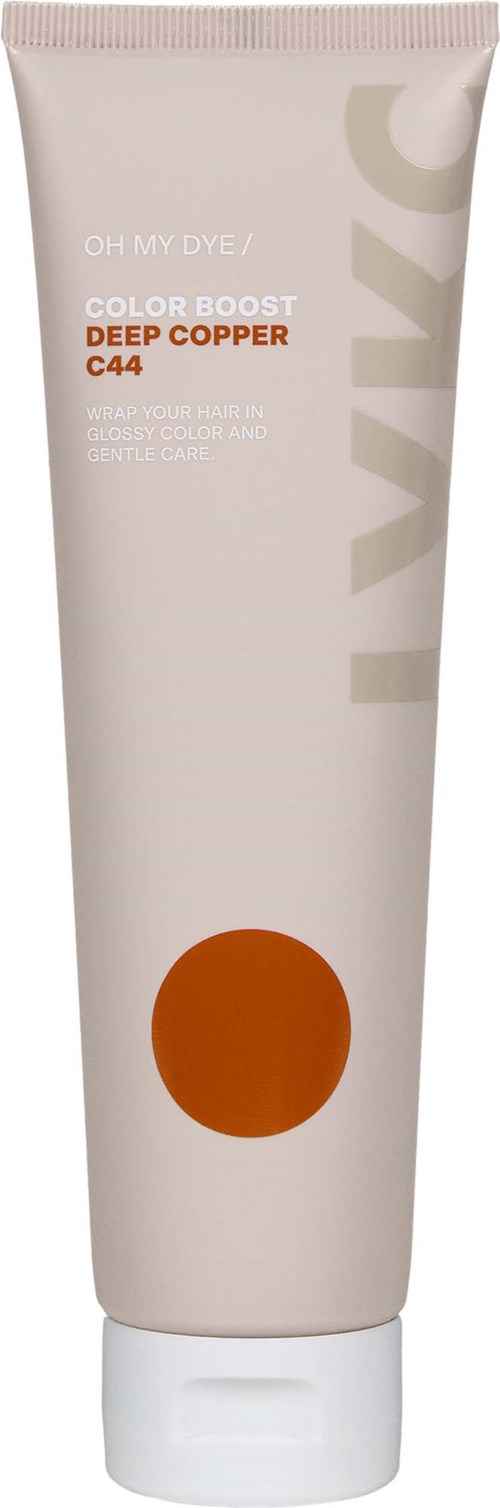 En vit tub med en brun cirkel och orange text, märkt som hårfärg för djup koppar.