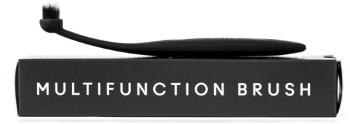 En svart, kurvad tandborste märkt "Multifunction Brush" på en box.