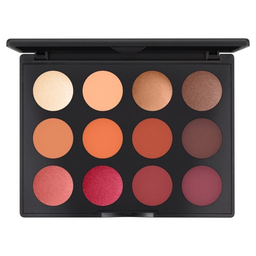 Eine Make-up-Palette mit zwölf runden Farbtönen in verschiedenen Farben, darunter Neutrale, Orange, Rot und Pink.
