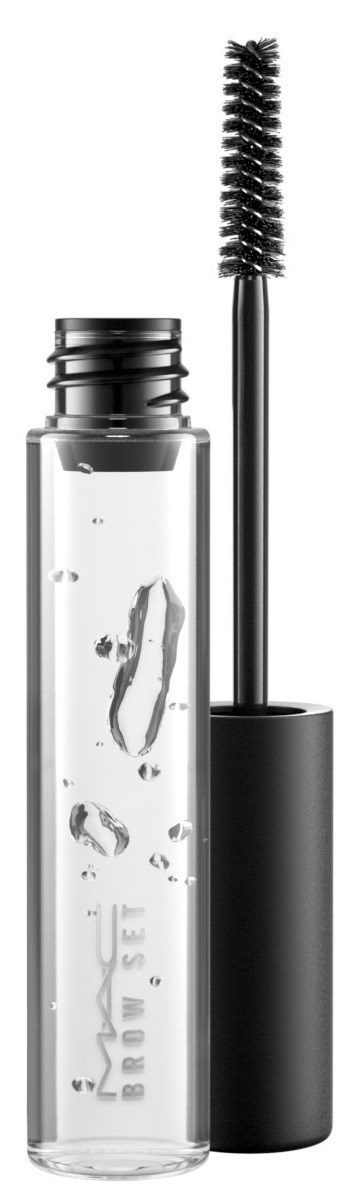En tydlig tub med en svart borste, troligen för mascara eller ögonbrynsgelé, står upprätt.