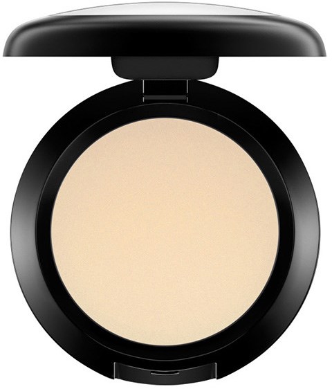 Ein beiges Puder in einer schwarzen runden Dose mit Deckel. Für Make-up oder Gesichtskorrekturen.