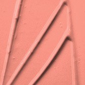 Närbild av en rosa texturerad yta med upphöjda linjer och geometriska former.