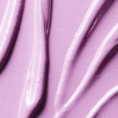 Close-up of pink gel-like substance with smooth, flowing textures and shiny appearance.