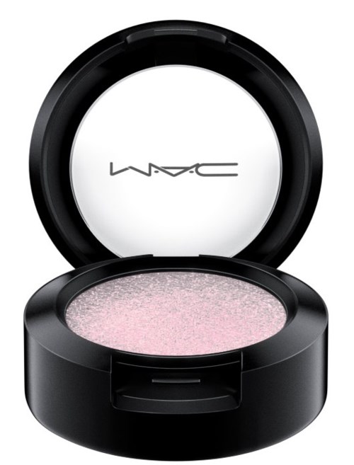 A MAC makeup compact with pink eyeshadow inside and a round mirror on top.