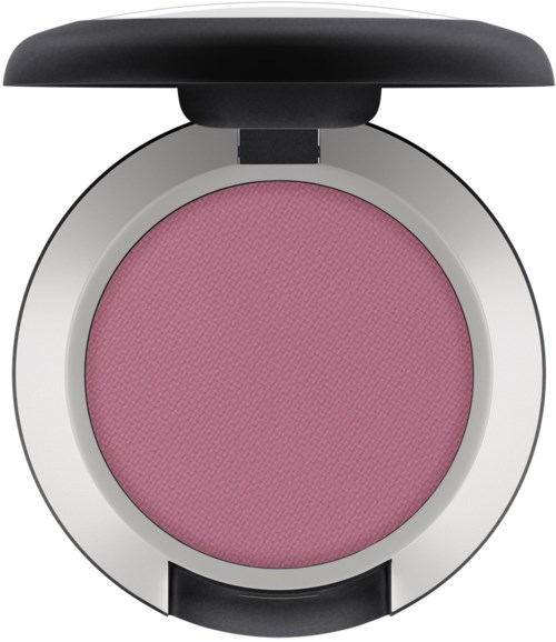 En rosa blush eller ögonskugga i en rund förpackning med svart lock, sedd uppifrån.