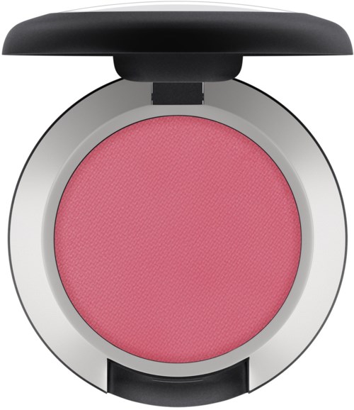 En rund makeuppuder med rosa rouge och ett svart lock på toppen.