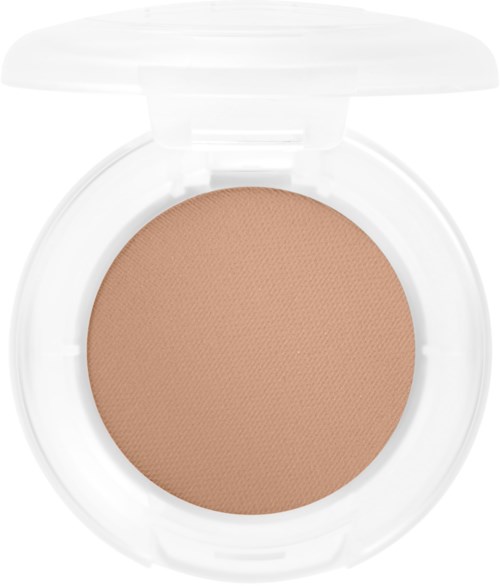 Ett runt sminkkompakt med beige puder inuti och ett genomskinligt lock.