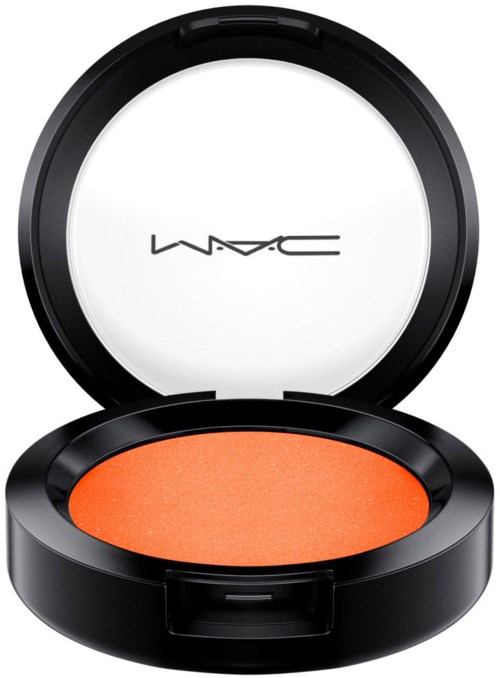 En rund svart makeup-compacta med orange rouge och spegel inuti.