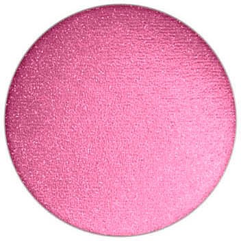 Ett rosa runt föremål med en strukturerad yta, som glittrar lätt. Det ser mjukt och slätt ut.