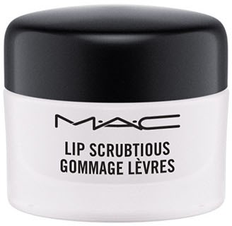 En vit burk med svart lock, märkt "MAC Lip Scrutious Gommage Lèvres."