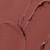 Nærbilde av sminke med brune og beige nyanser som viser glatte og teksturerte områder.