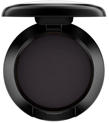 A round black compact with a lid partially open, revealing a powder inside, likely makeup.
