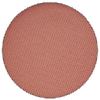 En rund blush med blid rosa farve og fin tekstur.