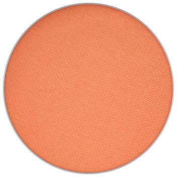 En rund, orange blush-compact med en glat, mat overflade. Ingen synlige tilfælde eller mærkeoplysninger.