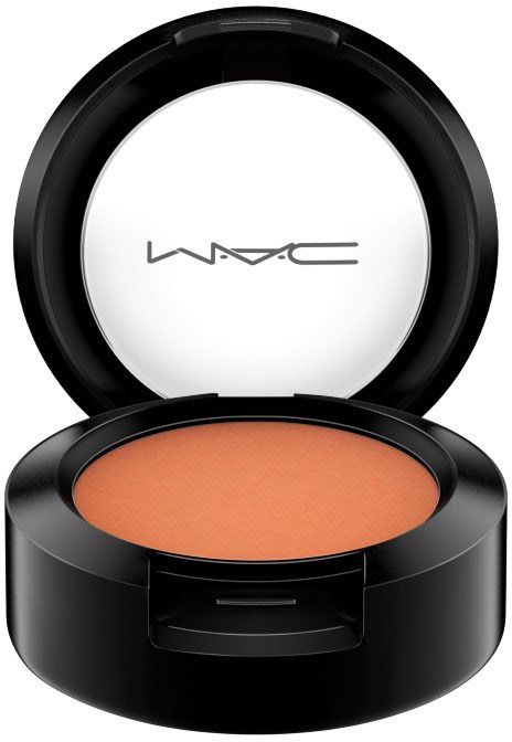 MAC Rouge in einer schwarzen runden Verpackung mit weißem Inneren und Logo, enthält pfirsichfarbenes Make-up.