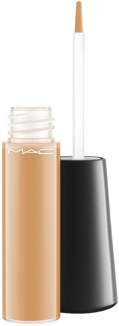 En beige flytande concealer i ett glasrör med svart lock och en fast applicator.