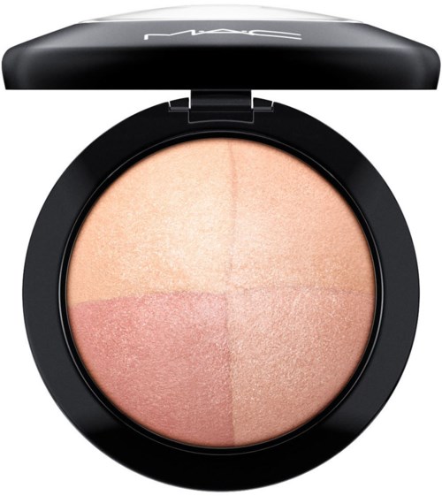 A makeup compact with four shades of blush or highlighter in a round black case.
